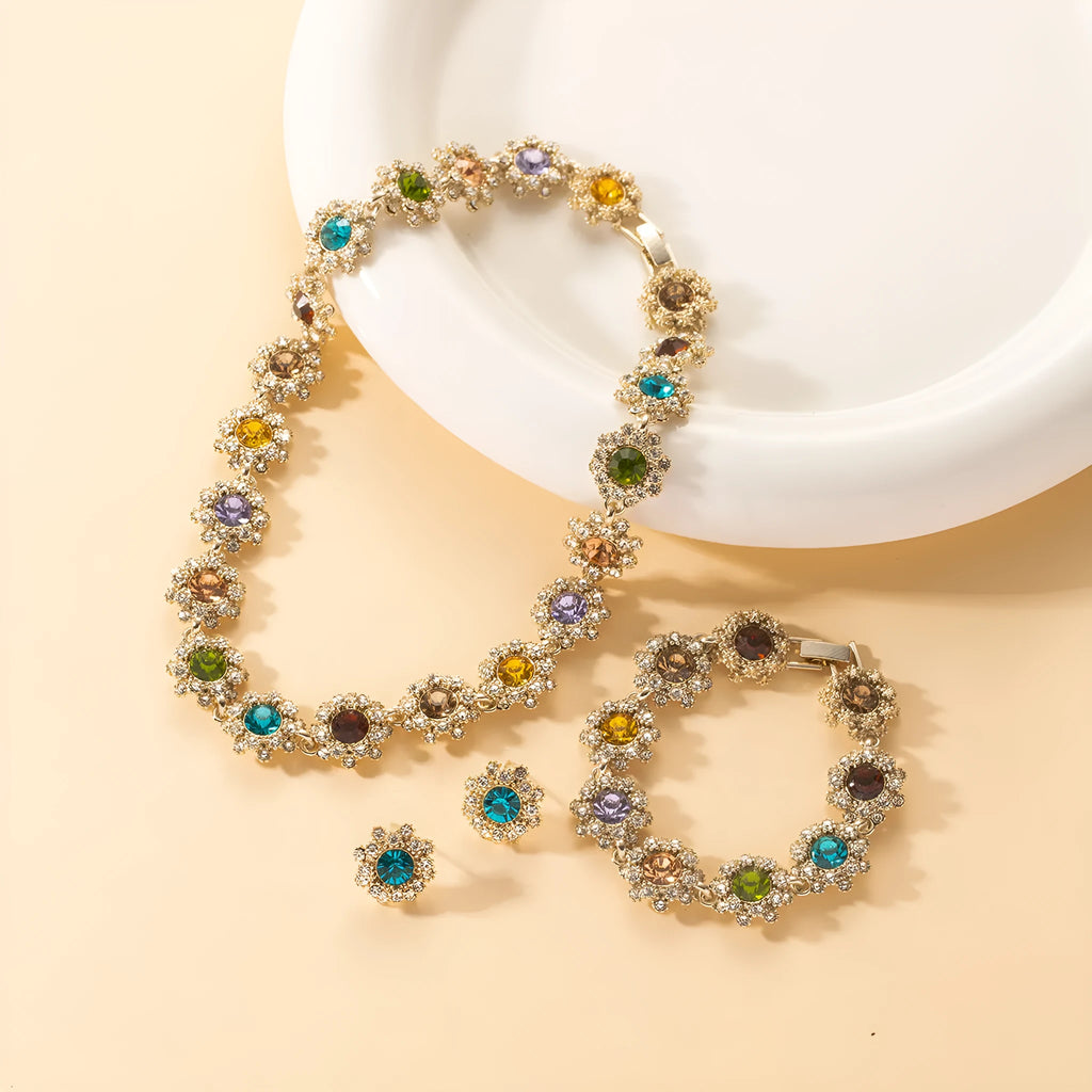 Women's jewellery set with rhinestone necklace, earrings, and bracelet in zinc alloy electroplated finish, geometric design