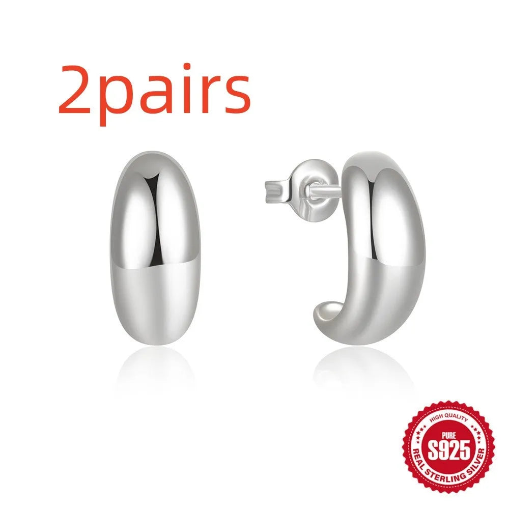 C-shaped geometric stud earrings in 925 sterling silver with glossy gold electroplated finish