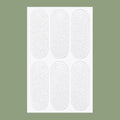 Close-up of transparent and frosted disposable TPU ear patches on backing paper, 0.1cm thick.