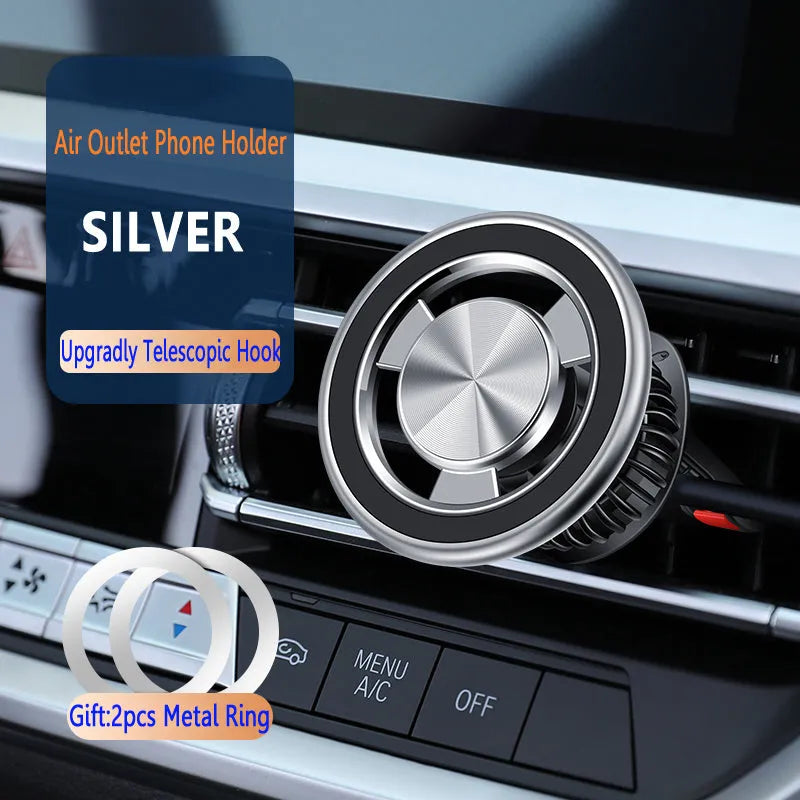 Silver car air vent magnetic phone holder mounted on vehicle ventilation with mobile phone attached