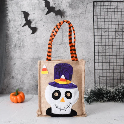 Halloween candy tote bag for kids featuring fun witch, skull, pumpkin, and black cat designs