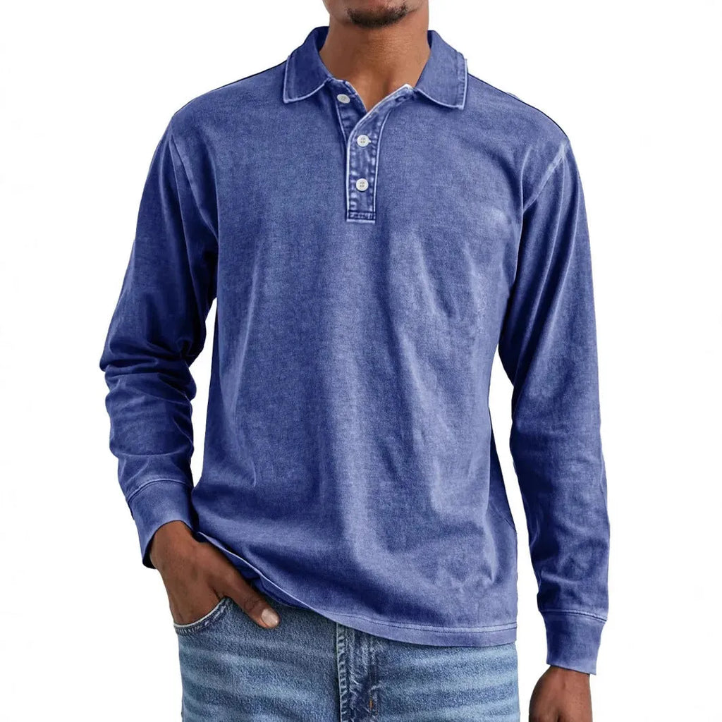 Man wearing a retro washed grey cotton polo shirt with distressed details and a lapel collar.
