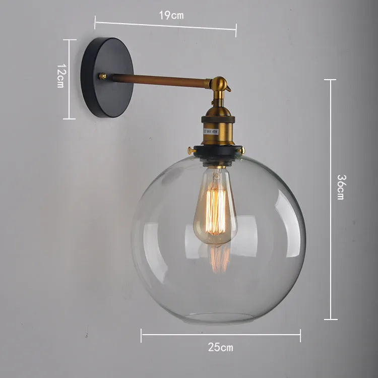 Round retro glass ball wall lamp in amber, smoke grey, or transparent finish with aluminium holder.