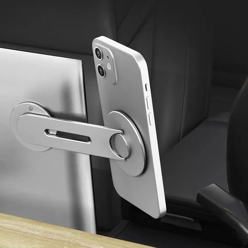 Silver magnetic phone holder for Tesla cars, showing its slim profile and 180-degree flip mechanism.
