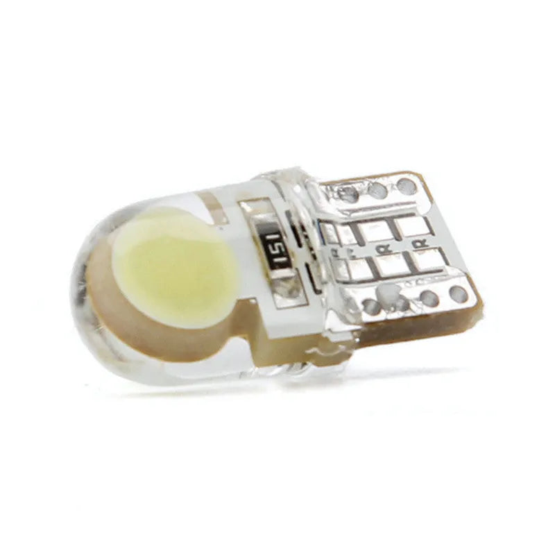 Ten silicone T10 LED car bulbs in various colours including white, red, blue, and yellow on a white background.