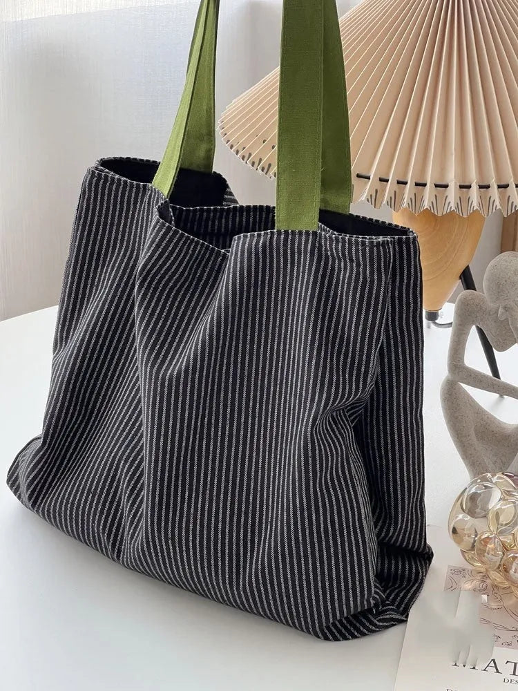 Canvas multi-layer tote shoulder bag showing three colour options: light pink stripes, black and gray plaid, dark gray stripes