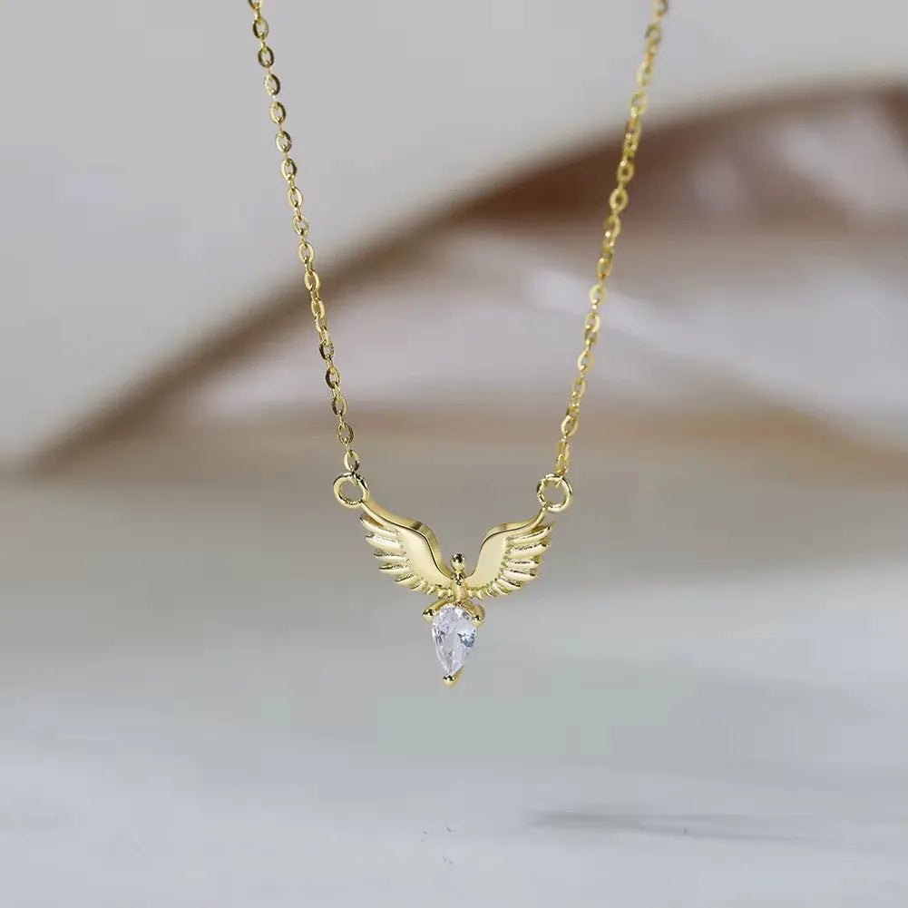 Eagle pendant necklace on an adjustable O-ring chain, available in white gold or yellow gold electroplate.