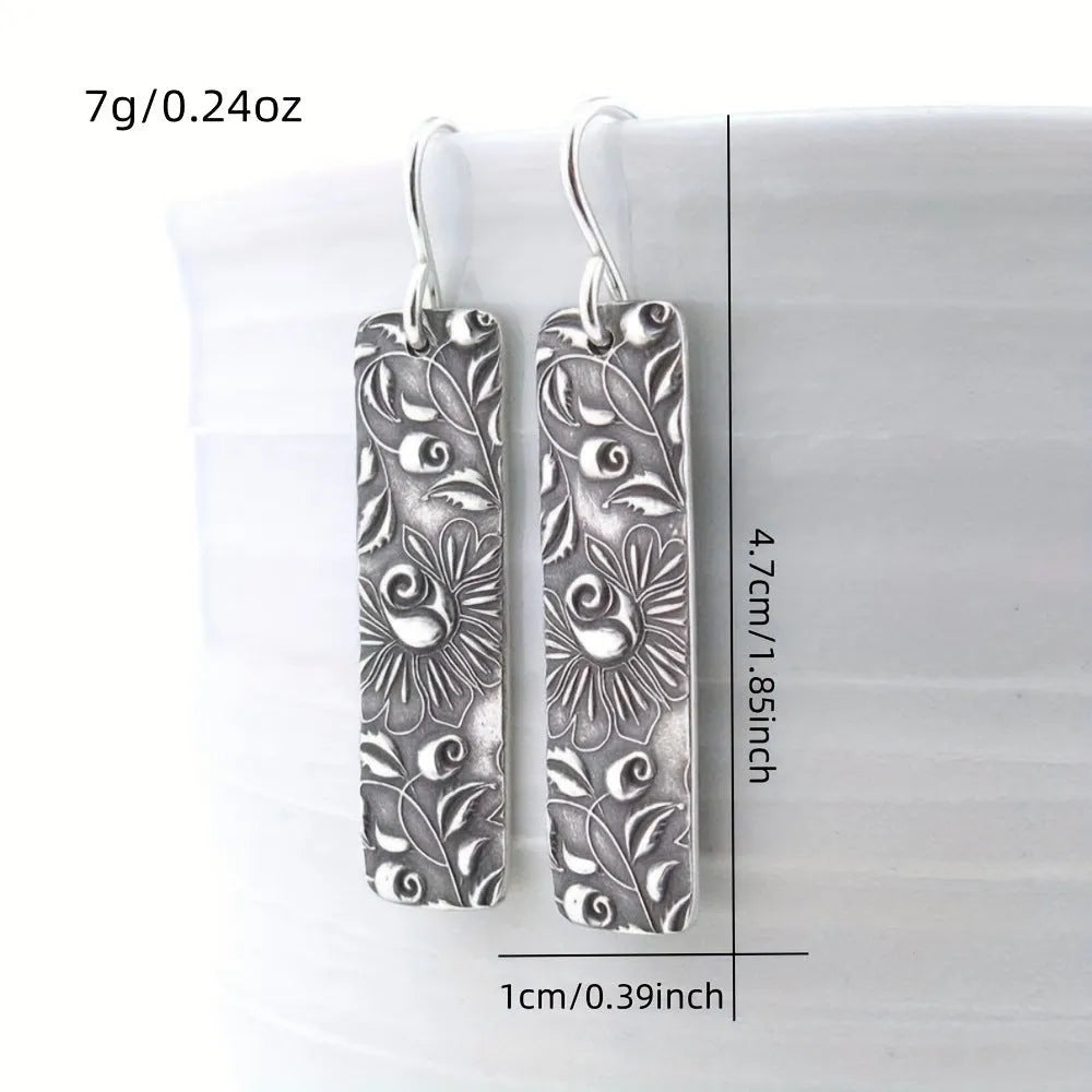 Silver geometric long drop earrings with carved vine patterns and retro design