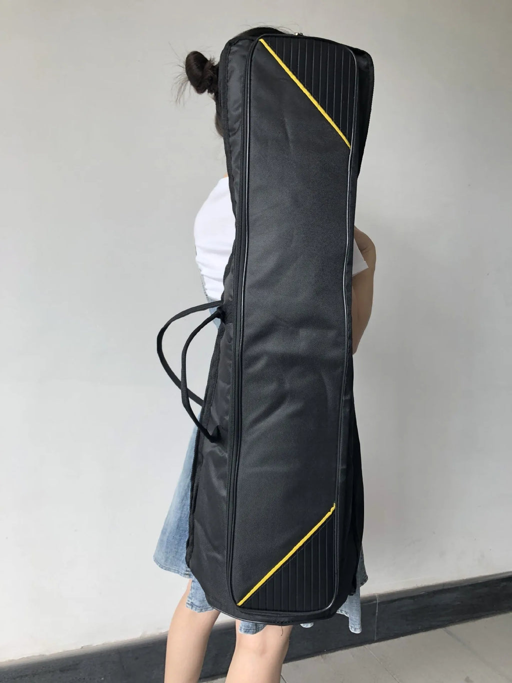 Black tenor trombone bag made of Oxford cloth with padded interior and outer pocket