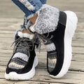 Beige women's lace-up suede snow boots with fuzzy lining and a thick soft sole platform.