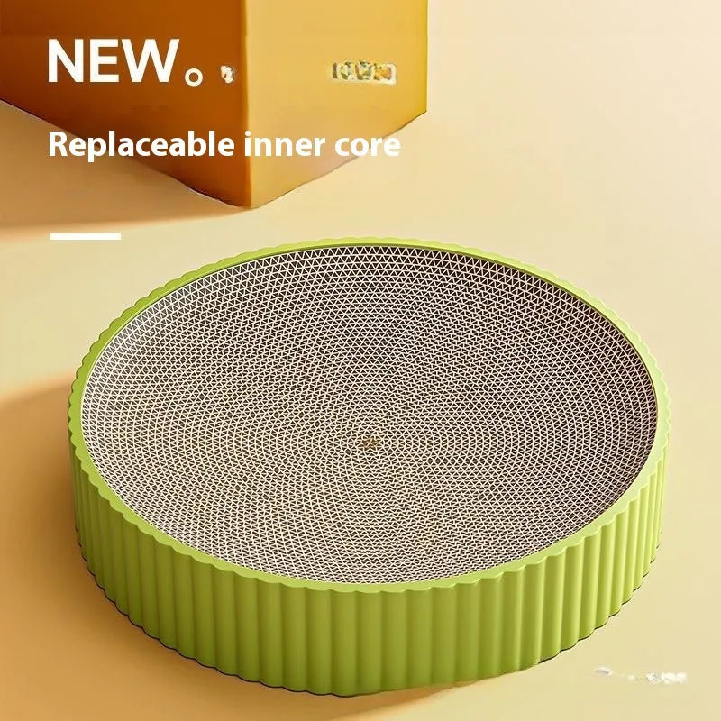 A round green cat scratching board made of corrugated cardboard, 55cm across, with two spare refills.