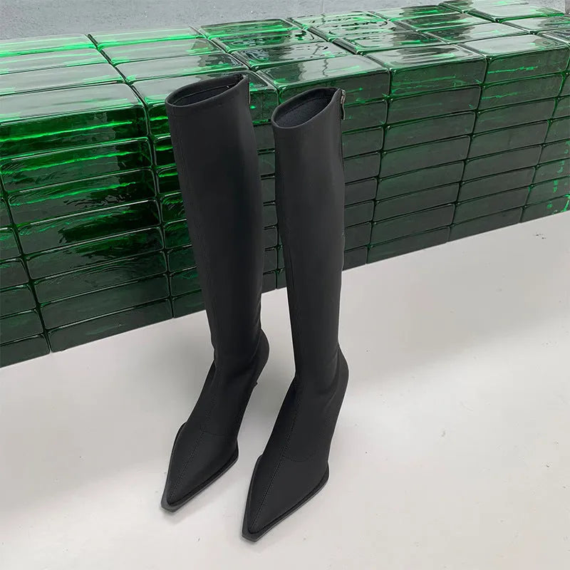 Black women's ankle boots with a pointed toe, stiletto heel, and a back zip fastening.
