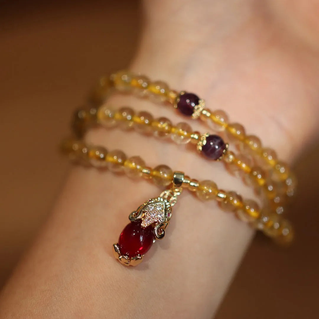 Natural Brazil rutilated quartz bracelet with golden needles and Chinese style hanging chopsticks design
