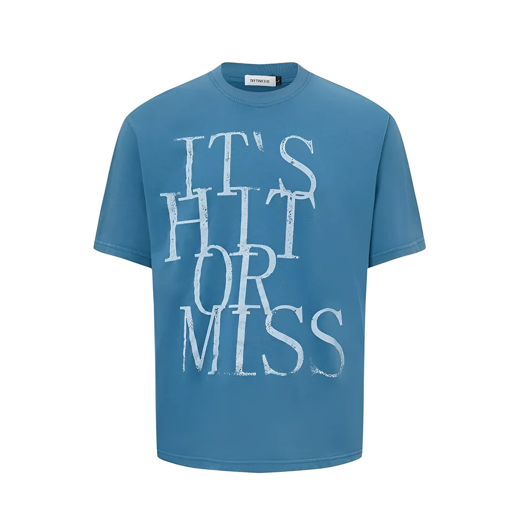 Man wearing a blue loose-fit cotton blend T-shirt with a retro white letter print design on the chest.