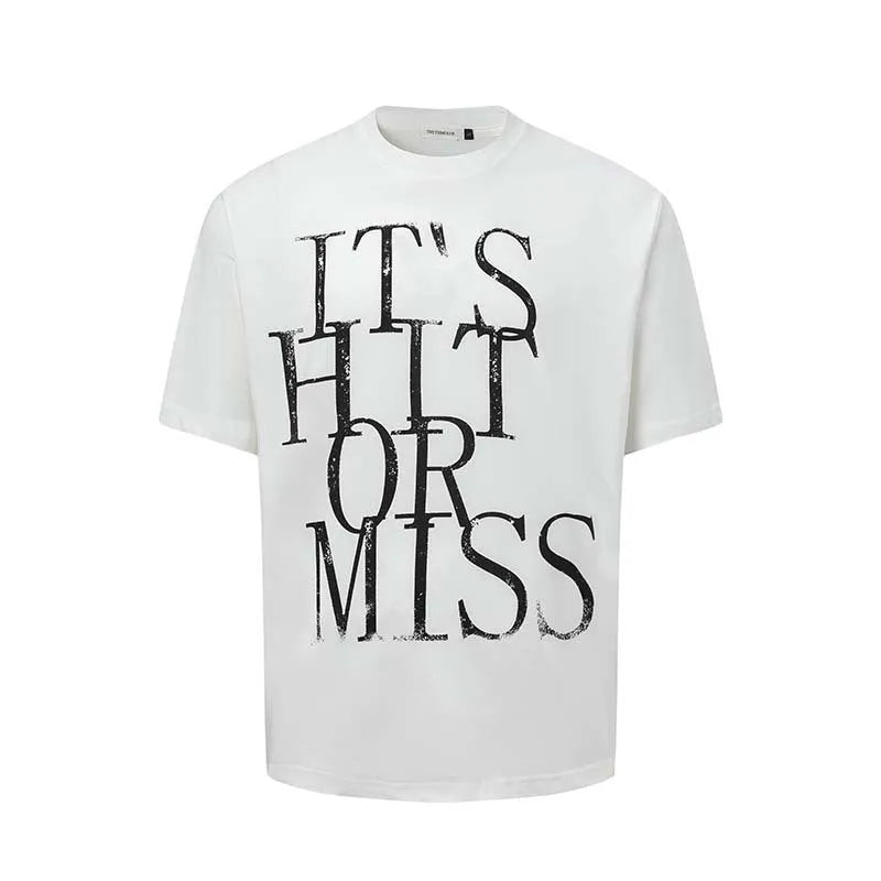 Man wearing a blue loose-fit cotton blend T-shirt with a retro white letter print design on the chest.