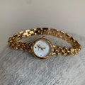 Women's alloy quartz watch with gold strap and rhinestone dial fritillary surface