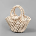Maple wood woven dumpling-shaped handbag with wooden bead decoration, shown in milky white.