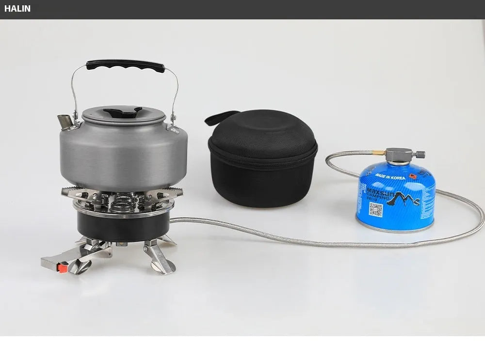 Silver portable split stove for outdoor camping and picnics on a flat surface.