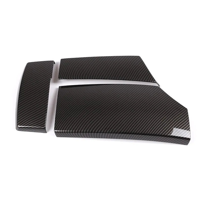 Three ABS armrest box protective covers with carbon fibre weave pattern showing polished surface