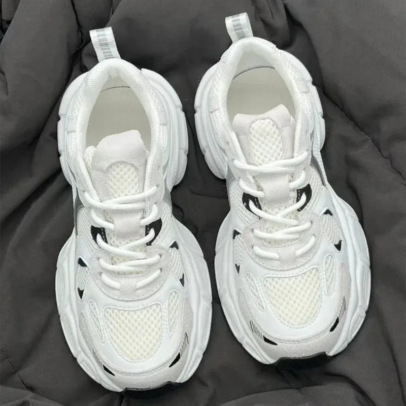 Beige mesh platform sports shoes with a wedge heel and front lace-up fastening on a rubber sole.