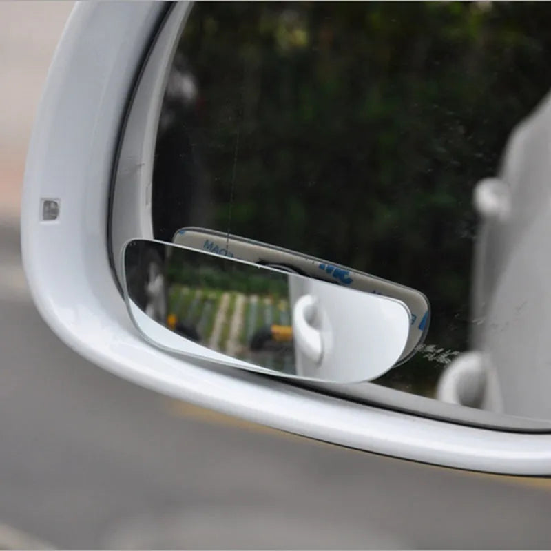 Universal adjustable car blind spot mirror with glass lens and adhesive mount shown in multiple colours.