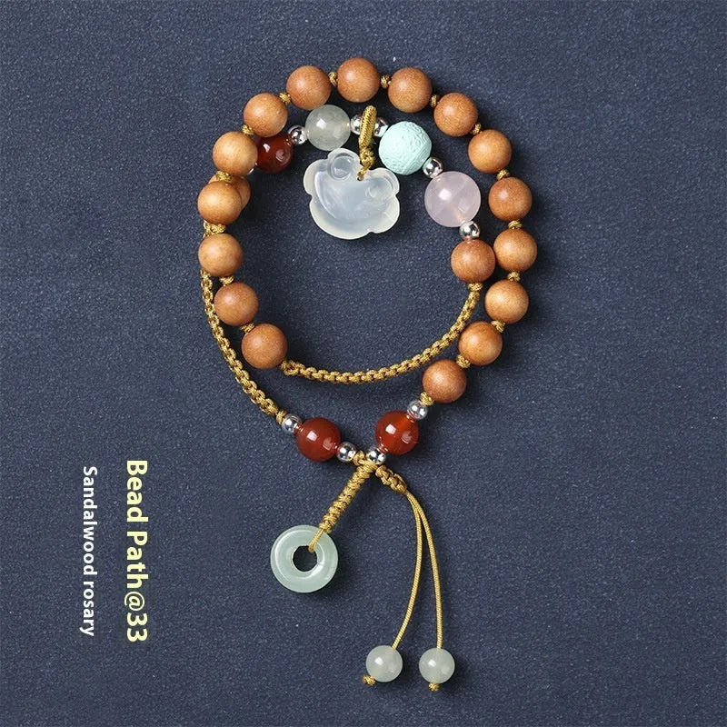 Hand-woven ebony wood bracelet with gemstone elements in double ring national style design