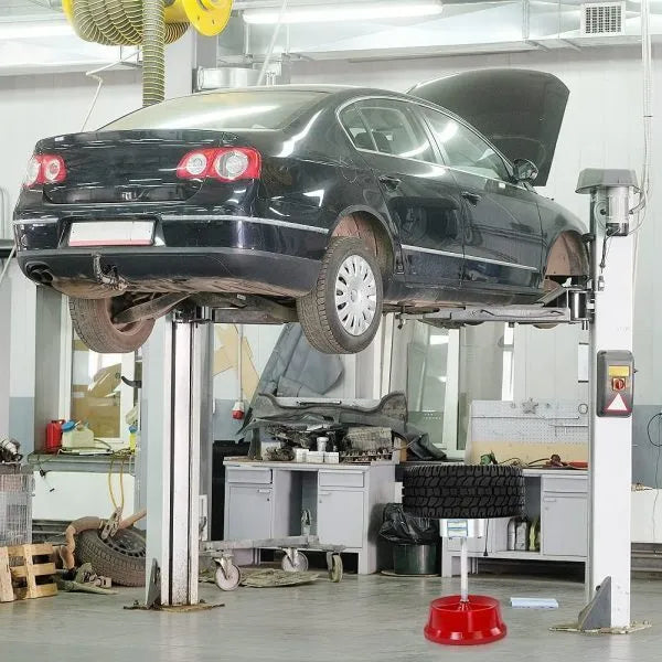 Portable aluminium hub wheel balancer with bull's eye level on enamel base.