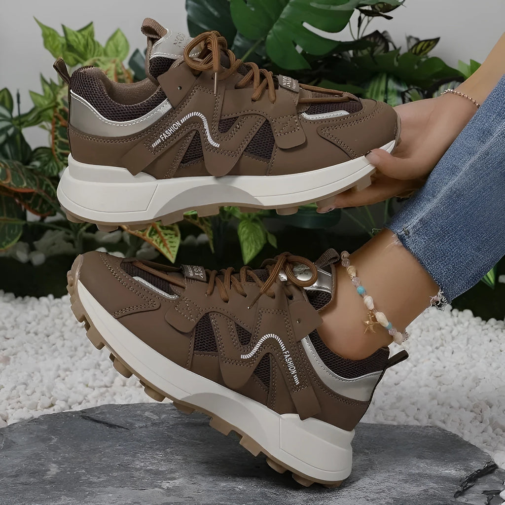 Brown casual clunky sneakers with round toe, lace-up closure, and flat rubber sole on a neutral background