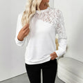 White long sleeve loose pullover top with a floral pattern.