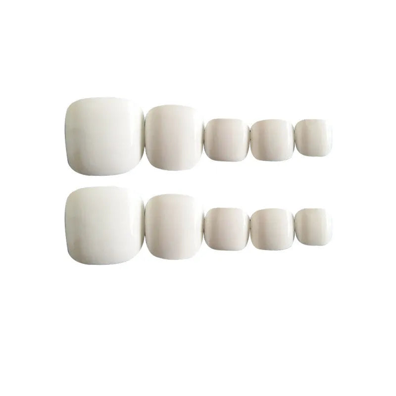 Set of false nail toes with starry sky pattern design and white glue for ladies.