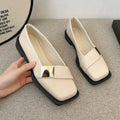 Beige women's square toe flat slip-on shoes with a metal buckle and low square heel.