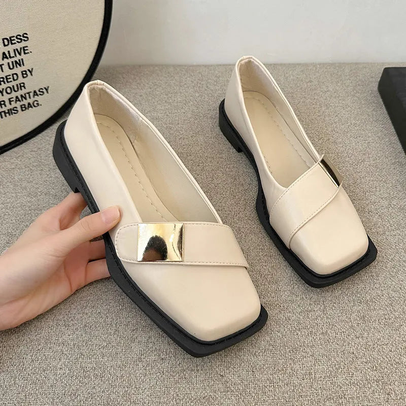 Beige women's square toe flat slip-on shoes with a metal buckle and low square heel.