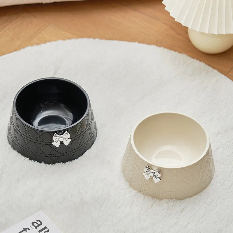 Ceramic pet bowl with bowknot and diamond pattern in pink, silver, black, purple, or white.