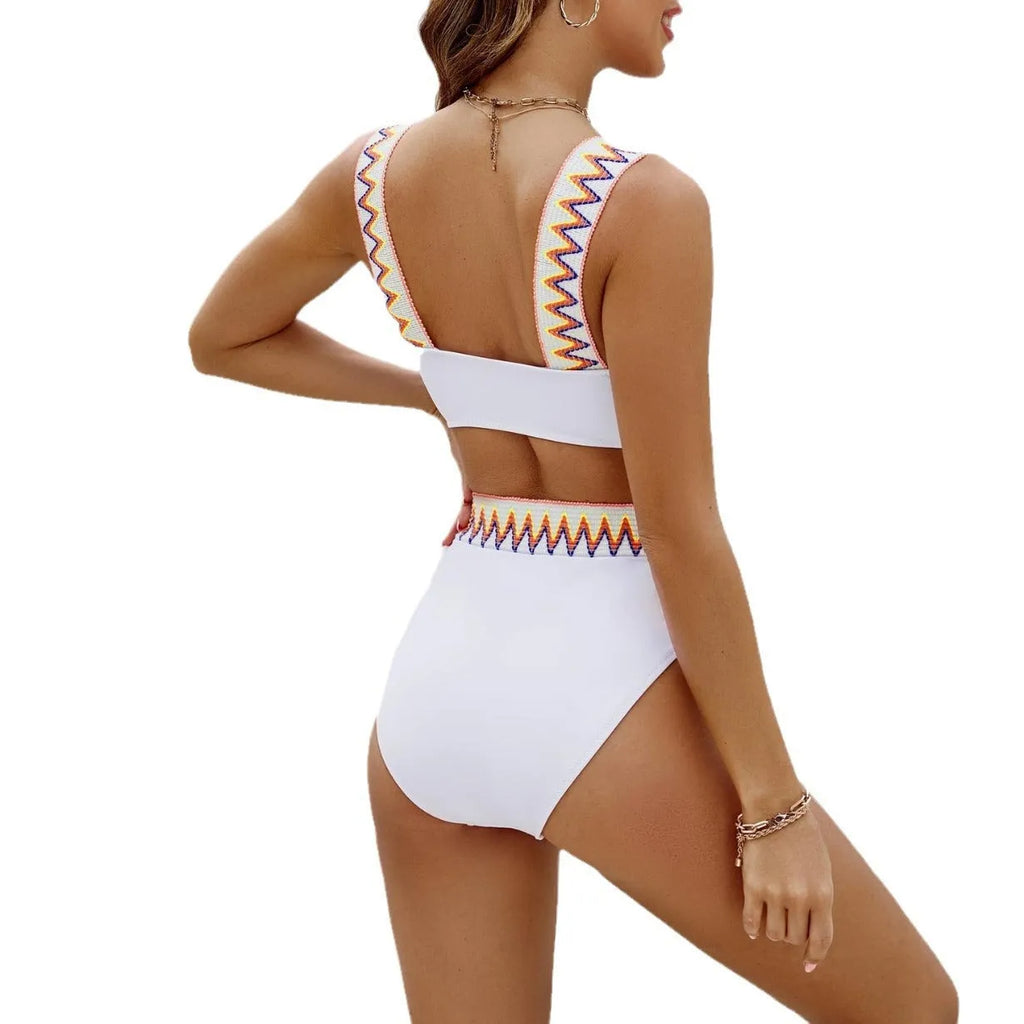 Black and white lace-up women's bikini swimsuit with high-waist briefs laid flat.