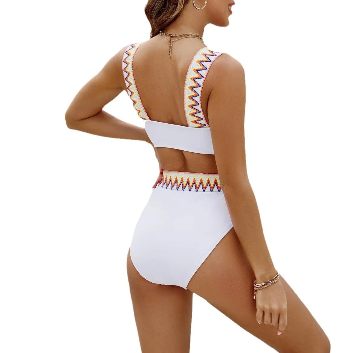 Black and white lace-up women's bikini swimsuit with high-waist briefs laid flat.