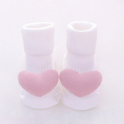 Cotton baby socks in various designs for newborns to 3-month-olds