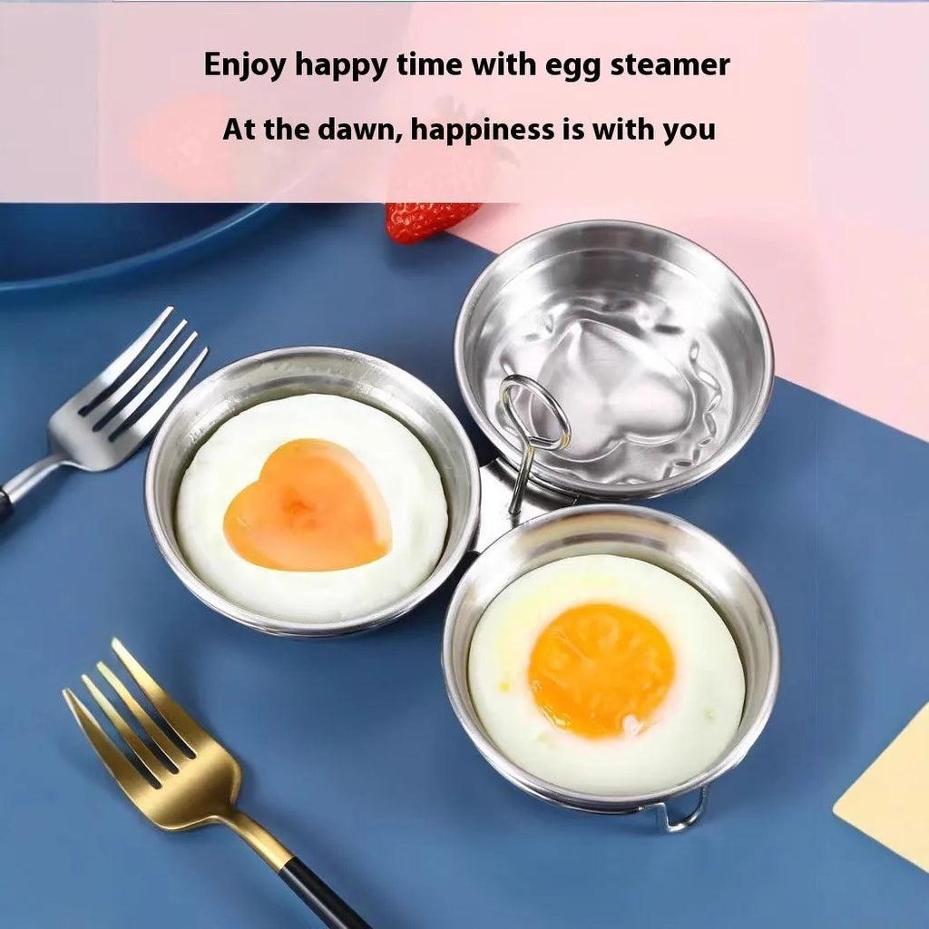 Mini stainless steel heart-shaped egg steamer for cooking soft-boiled or poached eggs on a stove.