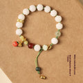 White jade bodhi bracelet with hand-woven lotus and pumpkin beads on open rope
