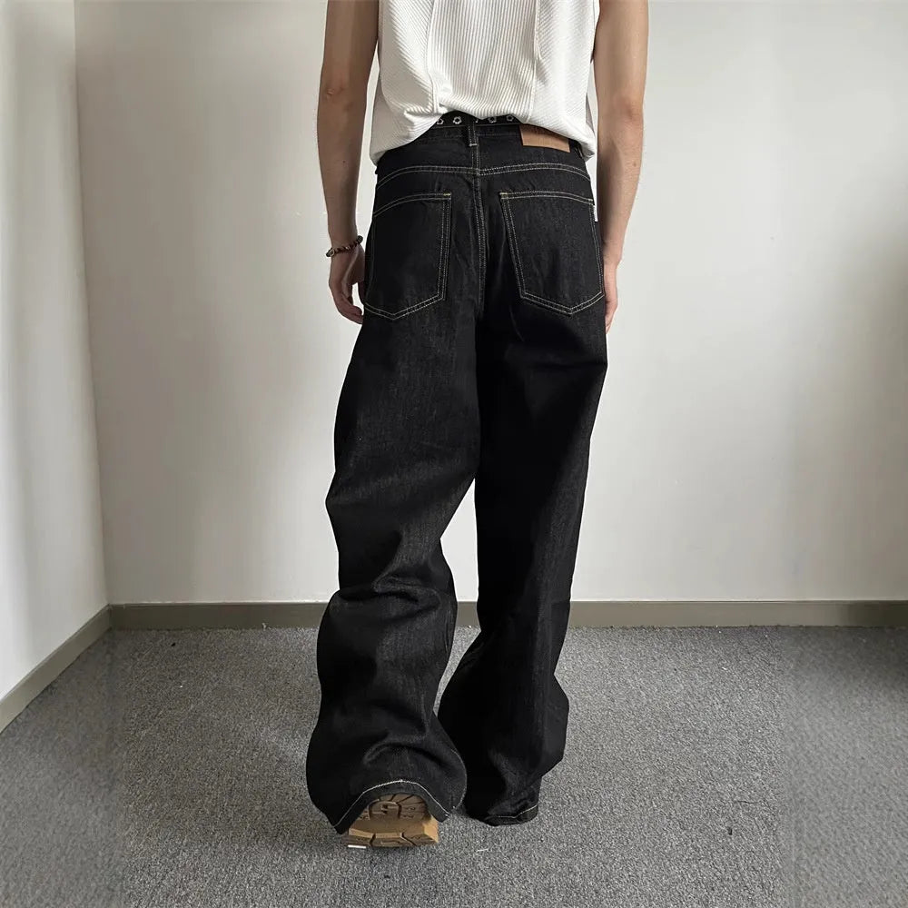 Black retro wide-leg jeans with straight-leg design and zip fly opening