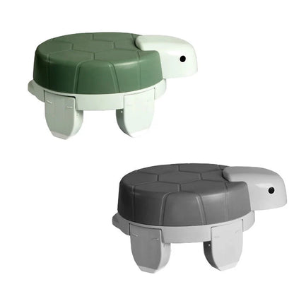 Children's portable folding training toilet with cute turtle design, ideal for potty training at home or on the go.