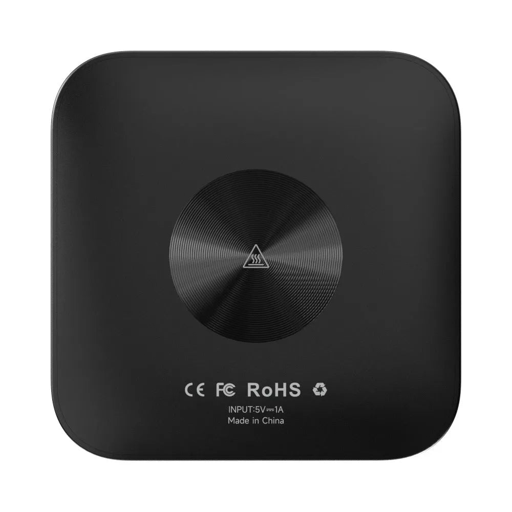 Compact square wireless CarPlay adapter box for cars with factory wired CarPlay systems.