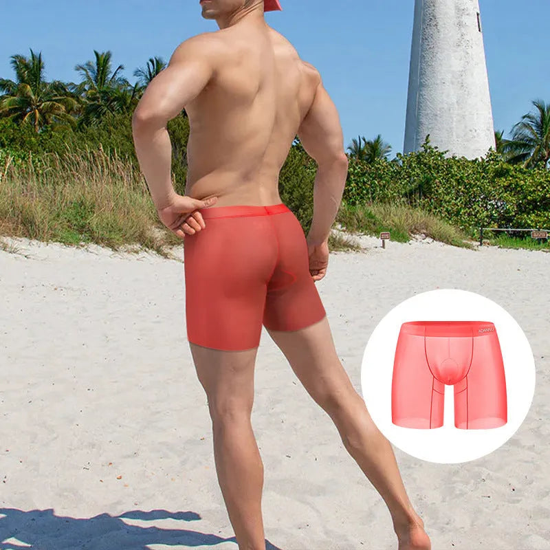 Men's ice silk boxer shorts in solid orange colour showing low-waist design and elastic waistband