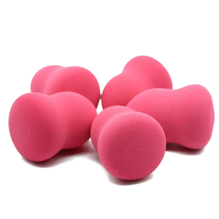 Pink rectangular makeup foundation sponge for wet or dry application measuring 4cm by 4cm by 5.6cm