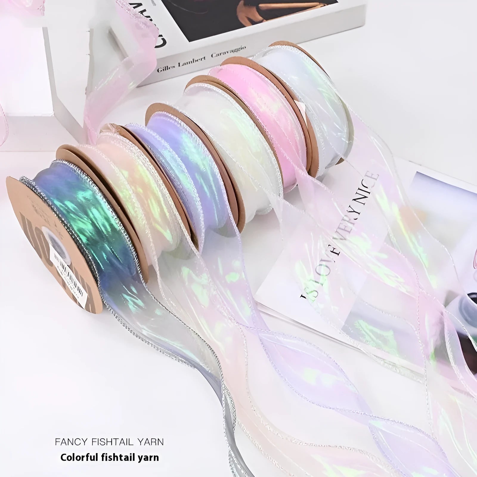 Roll of fishtail yarn floral design mesh craft ribbon in various colours, showing 4cm width.