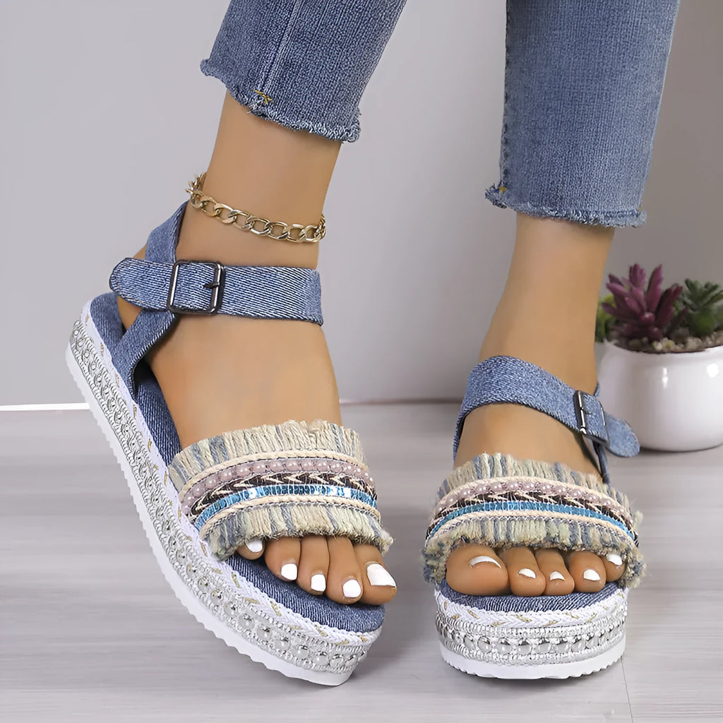 Women's tassel denim sandals with thick flat sole and buckle closure in blue