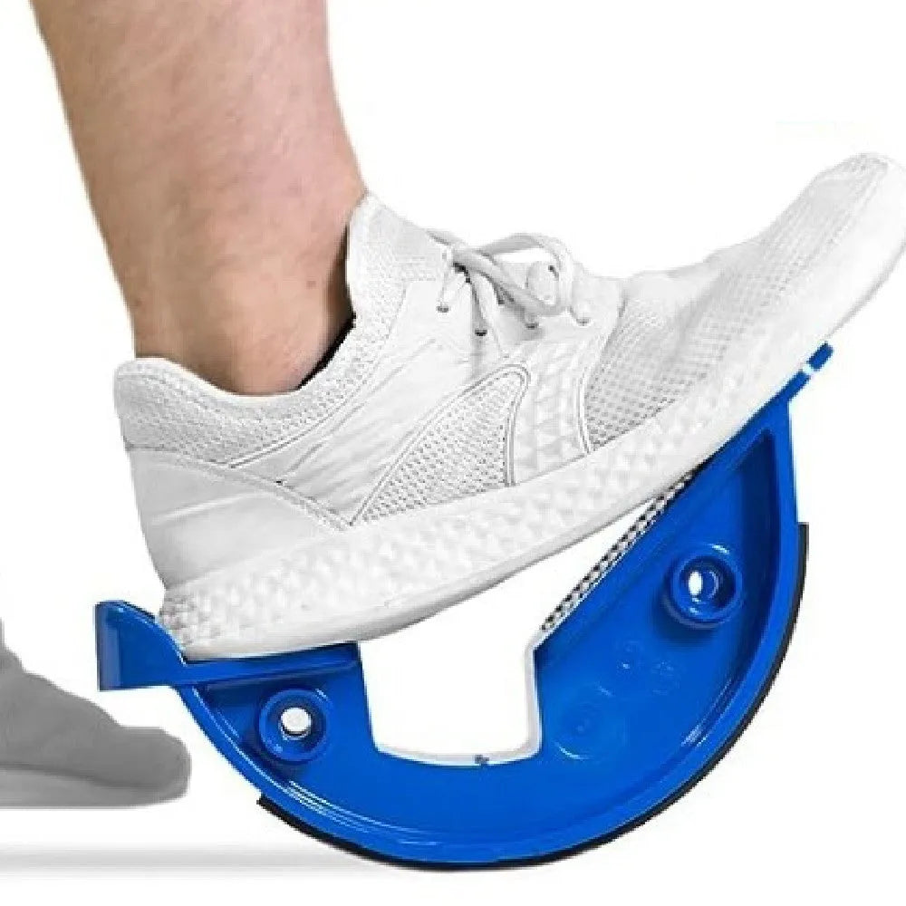 Royal blue lower leg tension plate stretcher with a diagonal pedal on a grey floor.
