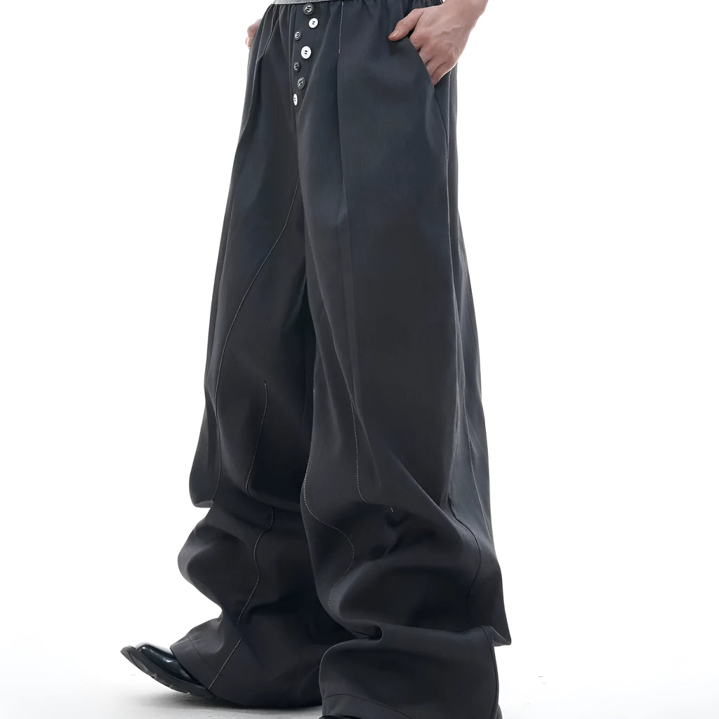 High-waist straight-leg trousers with a button detail on the leg in black or grey.