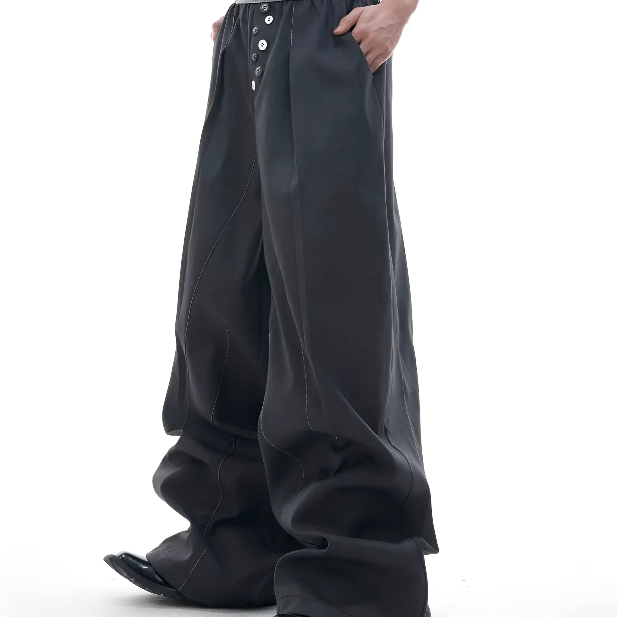 High-waist straight-leg trousers with a button detail on the leg in black or grey.