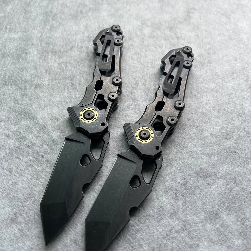 D2 steel folding knife with 9cm blade on outdoor background