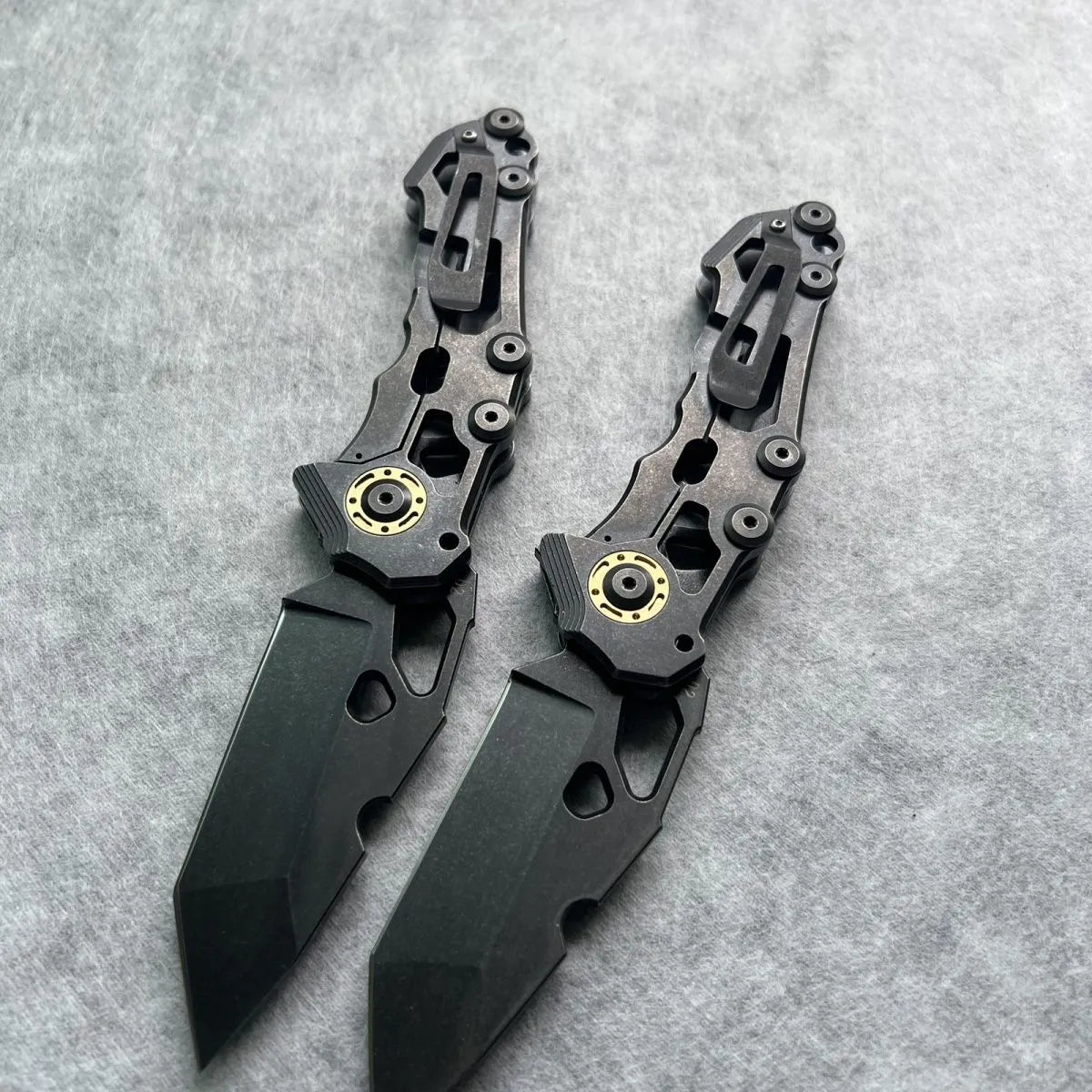 D2 steel folding knife with 9cm blade on outdoor background
